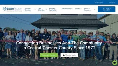 A group of people gathered outdoors, standing behind a ribbon at a ribbon-cutting ceremony. The banner above them reads "Connecting Businesses And The Community In Central Chester County Since 1972." Various navigation options and buttons are displayed at the top of the image.