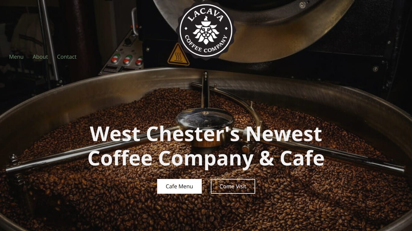 A close-up view of coffee beans being roasted in a large roasting drum. A logo at the top says "Lacava Coffee Company." Overlay text in the center reads, "West Chester's Newest Coffee Company & Cafe" with buttons labeled "Cafe Menu" and "Come Visit.